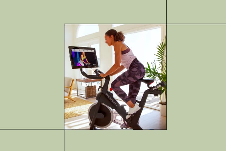 Best Exercise Bikes Hero Image Woman on Bike at Home