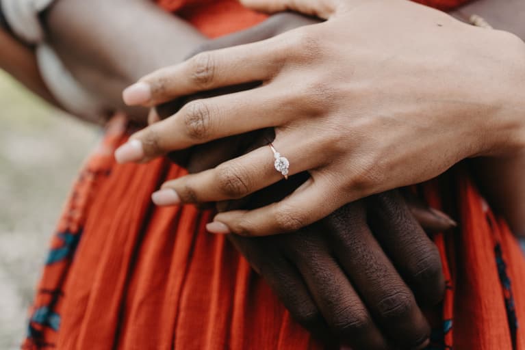 Recently Engaged Couple Holding Hands