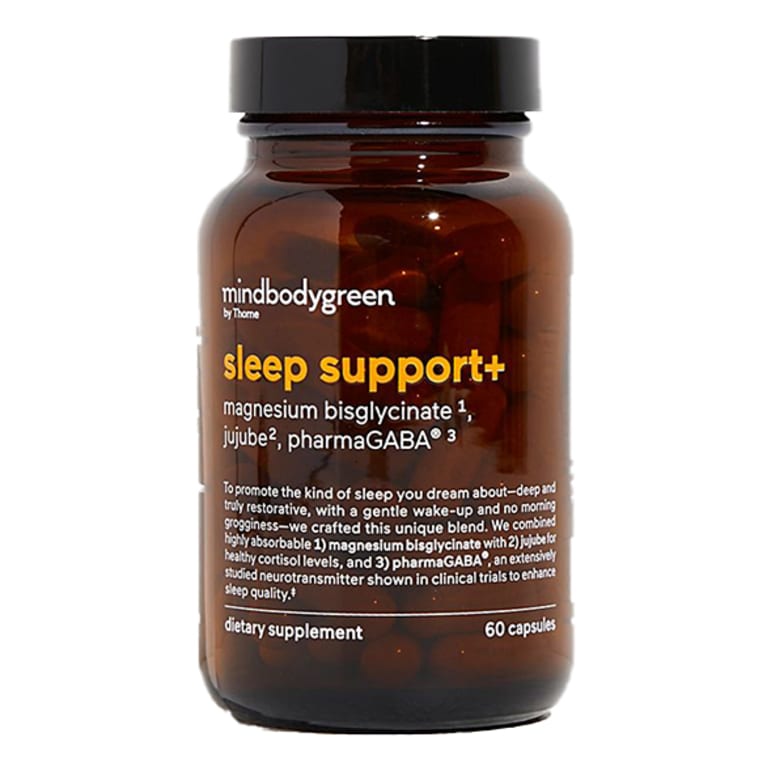 dark brown supplement bottle with orange letters