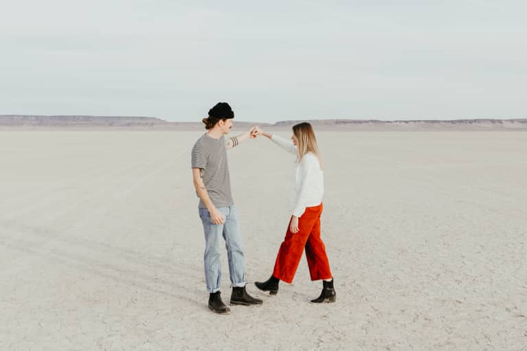 Man And Woman Dancing In A Desert