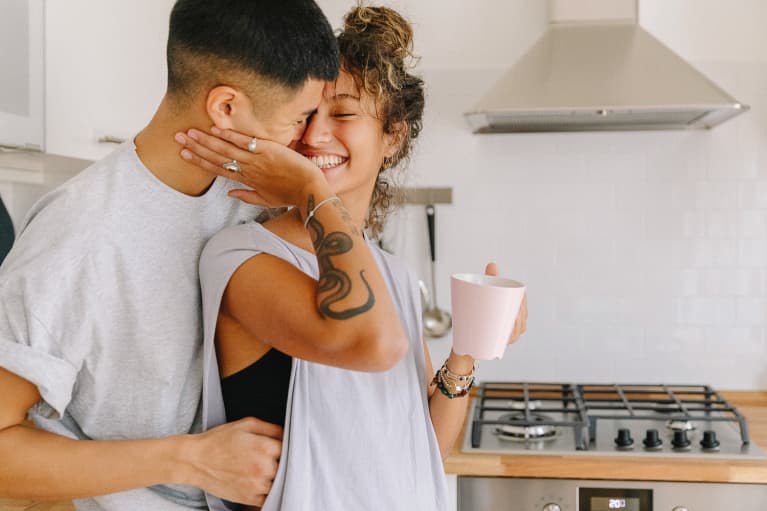 Happy Couple Embracing in a Kitchen