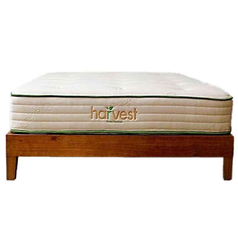 white mattress on brown bed