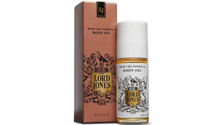 Lord Jones body oil in glass bottle next to red box