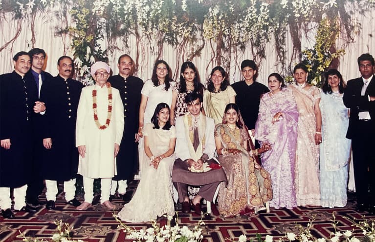 family gathered at traditional Indian wedding ceremony