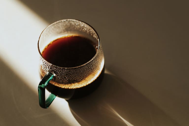 cup of black coffee in the sun