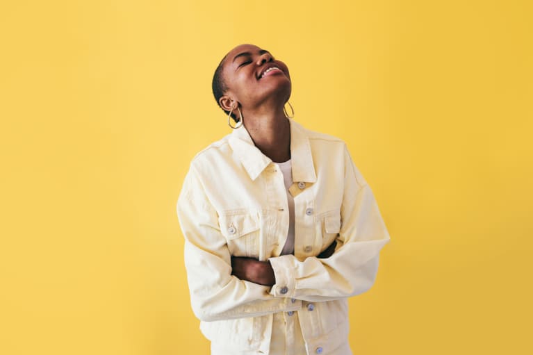 Smiling woman on a yellow background
