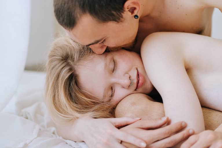 Couple in bed embracing